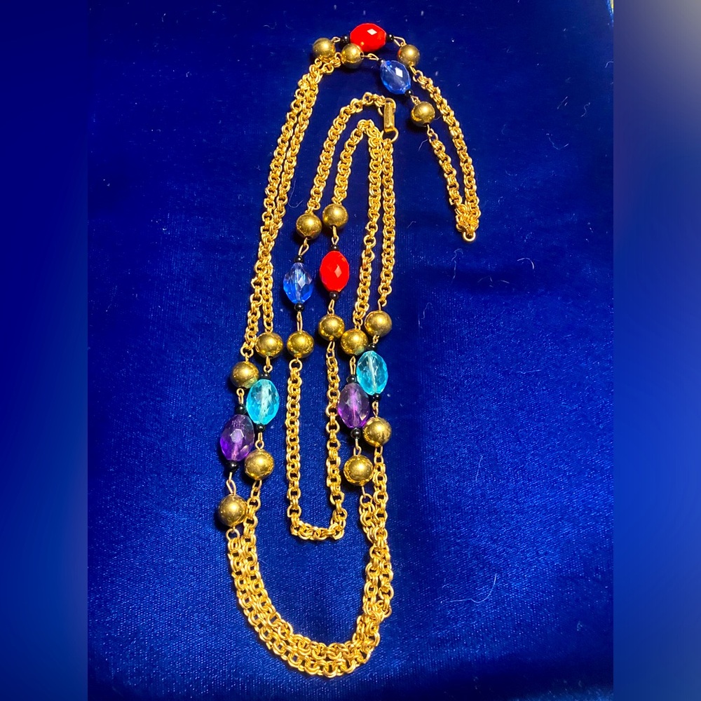 Vintage gold tone colored beaded necklace. 30” flapper length.